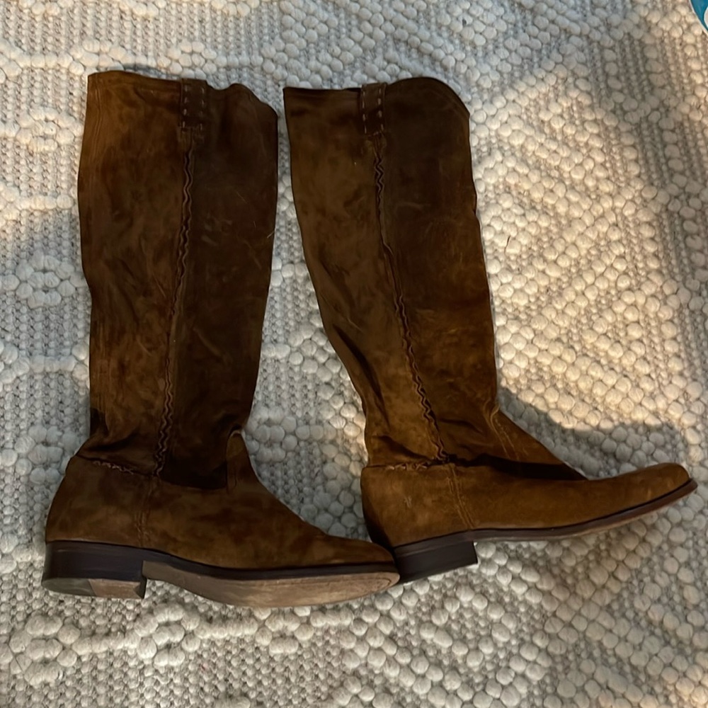Tall Frye boots with stitch detailing.
